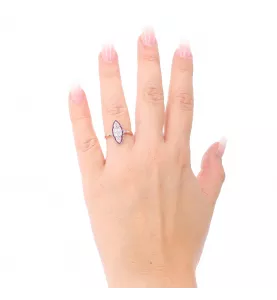 Bague or rose diamants et rubis.